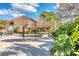 Relaxing beach area with thatched umbrellas at 606 Gran Bahama Boulevard # 29-606, Davenport, FL 33897