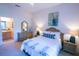 Main bedroom with a comfortable bed and ensuite bathroom at 606 Gran Bahama Boulevard # 29-606, Davenport, FL 33897