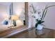 Reflective mirror shows a glimpse of the bedroom at 606 Gran Bahama Boulevard # 29-606, Davenport, FL 33897