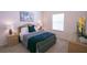 Grey and blue bedroom with a queen bed and wicker furniture at 606 Gran Bahama Boulevard # 29-606, Davenport, FL 33897