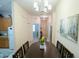 Dining area view from kitchen, with a table and chandelier at 606 Gran Bahama Boulevard # 29-606, Davenport, FL 33897