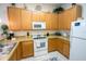 Well-equipped kitchen with wooden cabinets and appliances at 606 Gran Bahama Boulevard # 29-606, Davenport, FL 33897