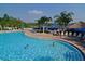 Resort-style pool with plenty of lounge chairs at 606 Gran Bahama Boulevard # 29-606, Davenport, FL 33897