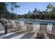 Relax by the community pool with lounge chairs at 606 Gran Bahama Boulevard # 29-606, Davenport, FL 33897