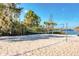 Beach volleyball court with sand and a net at 606 Gran Bahama Boulevard # 29-606, Davenport, FL 33897