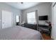 Comfortable bedroom with a desk and plenty of natural light at 7924 Bridgestone Dr, Orlando, FL 32835
