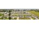 Community overview featuring numerous homes and a lake at 840 S Palm Ave, Frostproof, FL 33843