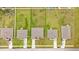 Aerial view showcasing four homes and their lots at 840 S Palm Ave, Frostproof, FL 33843