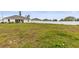 Large backyard with grassy area and privacy fence at 840 S Palm Ave, Frostproof, FL 33843
