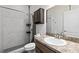 Bathroom with shower, toilet and vanity with large mirror at 840 S Palm Ave, Frostproof, FL 33843