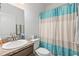 Clean bathroom with shower tub combo, toilet and vanity at 840 S Palm Ave, Frostproof, FL 33843