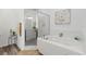 Relaxing bathroom with soaking tub and walk-in shower at 840 S Palm Ave, Frostproof, FL 33843