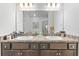 Double sink bathroom vanity with modern lighting at 840 S Palm Ave, Frostproof, FL 33843