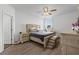 Primary bedroom with king bed, ceiling fan and dresser at 840 S Palm Ave, Frostproof, FL 33843