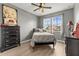 Bedroom with a twin bed, dresser, and window at 840 S Palm Ave, Frostproof, FL 33843