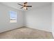 Bright bedroom with ceiling fan and carpeted floor at 840 S Palm Ave, Frostproof, FL 33843