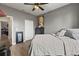 Primary bedroom with a queen bed and ceiling fan at 840 S Palm Ave, Frostproof, FL 33843
