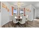 Bright dining room with hardwood floors and stylish light fixture at 840 S Palm Ave, Frostproof, FL 33843
