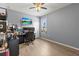 Home office with built-in shelving and hardwood floors at 840 S Palm Ave, Frostproof, FL 33843
