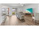 Relaxing living room with a large TV and electric fireplace at 840 S Palm Ave, Frostproof, FL 33843