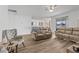 Spacious living room featuring hardwood floors and ample natural light at 840 S Palm Ave, Frostproof, FL 33843