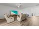 Bright living room with recessed lighting, hardwood floors, and comfortable seating at 840 S Palm Ave, Frostproof, FL 33843