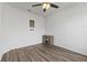 Cozy spare bedroom with wood-look floors and neutral decor at 840 S Palm Ave, Frostproof, FL 33843