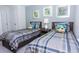 Bedroom with two twin beds and nightstand at 1534 Carey Palm Cir, Kissimmee, FL 34747