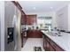 Modern kitchen with stainless steel appliances and granite countertops at 1534 Carey Palm Cir, Kissimmee, FL 34747