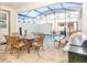 Private screened patio with pool, table, chairs, and grill at 1534 Carey Palm Cir, Kissimmee, FL 34747