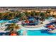 Aerial view of a large community pool and lazy river at 1166 Aloha Blvd, Davenport, FL 33897
