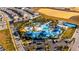 Large community pool and clubhouse, with surrounding homes at 1166 Aloha Blvd, Davenport, FL 33897