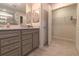 Elegant bathroom with double vanity and walk-in closet at 1166 Aloha Blvd, Davenport, FL 33897