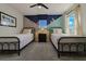 Charming bedroom with twin beds, playful decor, and lots of natural light at 1166 Aloha Blvd, Davenport, FL 33897