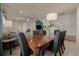 Bright dining room featuring a wood table and comfortable seating for eight at 1166 Aloha Blvd, Davenport, FL 33897