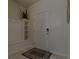 Entryway with bench, coat hooks, and tile flooring at 1166 Aloha Blvd, Davenport, FL 33897