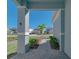 Brick walkway leading to the front door, with landscaping and neighborhood view at 1166 Aloha Blvd, Davenport, FL 33897