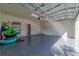 Attached garage with epoxy flooring and ample storage space at 1166 Aloha Blvd, Davenport, FL 33897