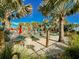 Relaxing hammock area near the pool with palm trees at 1166 Aloha Blvd, Davenport, FL 33897