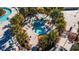 Circular hot tub surrounded by lounge chairs and palm trees at 1166 Aloha Blvd, Davenport, FL 33897