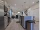 Modern kitchen with stainless steel appliances and an island at 1166 Aloha Blvd, Davenport, FL 33897
