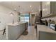 Modern kitchen featuring stainless steel appliances and breakfast bar at 1166 Aloha Blvd, Davenport, FL 33897