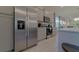 Modern kitchen with stainless steel appliances and ample counter space at 1166 Aloha Blvd, Davenport, FL 33897