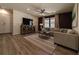Bright living room featuring hardwood floors and a modern aesthetic at 1166 Aloha Blvd, Davenport, FL 33897