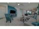 Spacious living room with sectional sofa, coffee table, and large TV at 1166 Aloha Blvd, Davenport, FL 33897