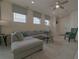 Bright living room featuring a sectional sofa and ample natural light at 1166 Aloha Blvd, Davenport, FL 33897