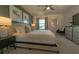Large main bedroom with plush bed and view of backyard at 1166 Aloha Blvd, Davenport, FL 33897