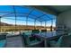 Relaxing patio with outdoor dining set and grill at 1166 Aloha Blvd, Davenport, FL 33897
