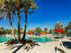 Inviting pool area with palm trees and lounge chairs at 1166 Aloha Blvd, Davenport, FL 33897