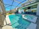 Inviting pool and spa with covered patio at 1166 Aloha Blvd, Davenport, FL 33897